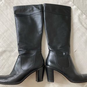 Tall black genuine leather boots with versatile style